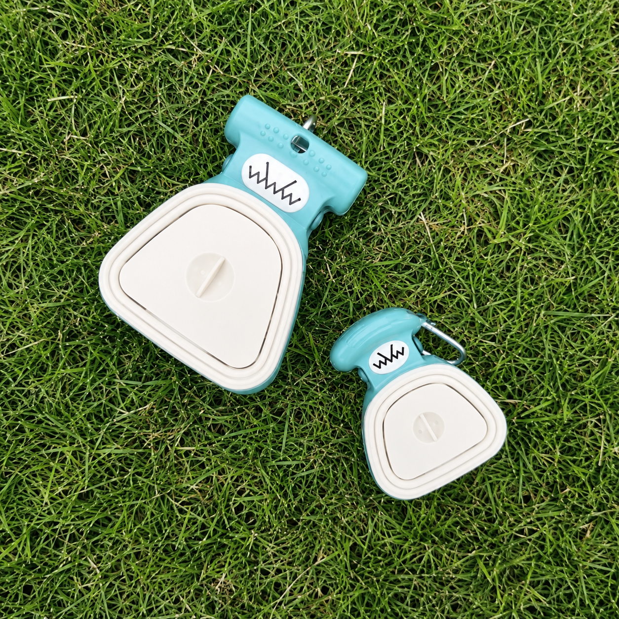 PawsSource Portable Dog Poop Scooper in Powder Blue and White – Small and Large Foldable Pet Waste Scoopers on Grass